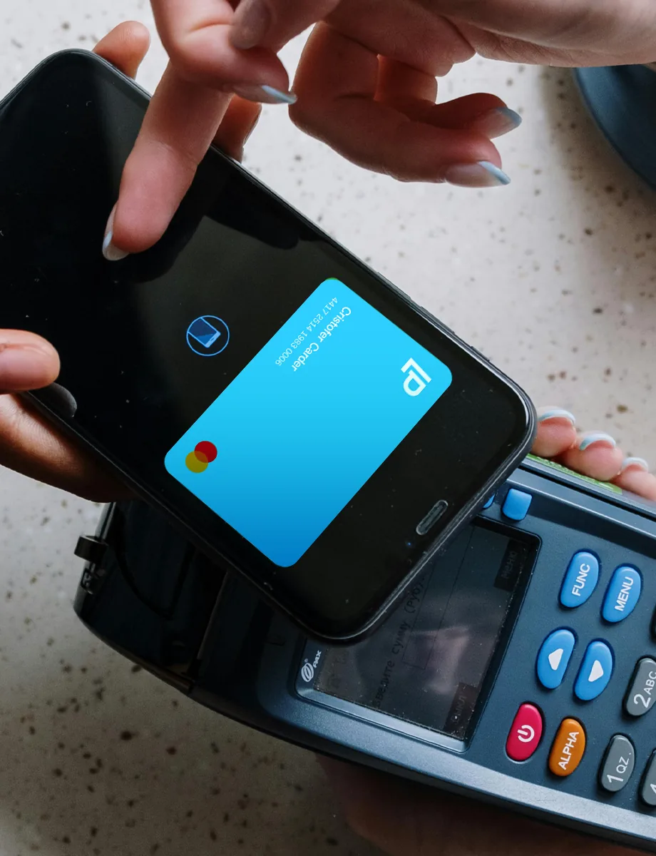 Phone with a wallet card held over a card terminal